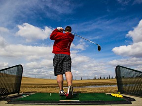 Spring swings. Michael Tesarski practices his swing at the Mill Woods Golf Course driving range in Edmonton, Alta., on Monday, April 6, 2015. Codie McLachlan/Edmonton Sun/QMI Agency