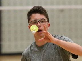 Sebastien Stefankow, of Ecole secondaire Macdonald-Cartier, competes in the senior boys badminton final at the city championship at St. Benedict Catholic Secondary School  in Sudbury, Ont. on Saturday April 11, 2015.