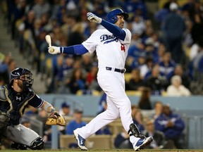 Adrian Gonzalez socks his second of three home runs on the game Wednesday night. (AFP)