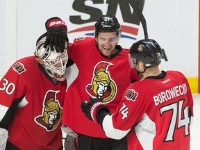 Feb 18, 2015; Ottawa, Ontario, CAN; Ottawa Senators goalie Andrew Hammond (30) right wing Mark Stone (61) and defenseman Mark Borowiecki (74) celebrate their win against the Montreal Canadiens at the Canadian Tire Centre. The Senators defeated the Canadiens 4-2. Mandatory Credit: Marc DesRosiers-USA TODAY Sports