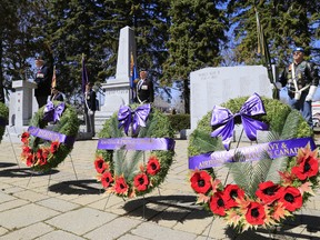 Three war milestones from the First and Second World Wars — the Battle of Vimy Ridge, the Battle of the Atlantic and V-Day — are remembered during a commemorative service at the Cenotaph at Memorial Park in Belleville, Ont. Sunday, March 12, 2015. - Jerome Lessard/Belleville Intelligencer/QMI Agency
