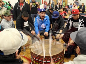 Drummers perform a song for the dancers at the Northern College spring powwow.