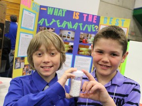 Wyoming Public students Keenan Reidhead, 10, and Jace McGrail, 9, hold up an alternative to road salt at the Lambton County Science Fair on Saturday April 11, 2015 in Sarnia, Ont. The pair picked up several awards for their project investigating alternatives to traditional rock salt after a recent lawsuit involving the substance. (Barbara Simpson/Sarnia Observer/QMI Agency)