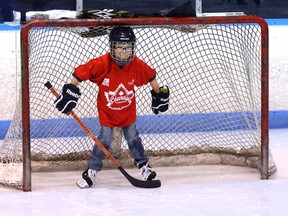 Luke Isaac, 9, of London guards the net at Thompson Arena Thursday during an outing for visually impaired pupils organized by Courage Canada Hockey for the Blind before their hero Knights fell to the Otters in playoff action. (MORRIS LAMONT, The London Free Press)