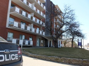 A Hamilton Police cruiser remained outside a Queenston Rd. apartment building Sunday afternoon, several hours after a shooting left the gunman dead and three others in hospital. (MARYAM SHAH, Toronto Sun)