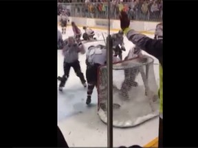 Members of the Selkirk Fishermen and Peguis Juniors throw down during a massive brawl in Manitoba on Saturday. (YouTube screen grab)