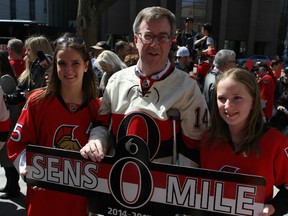 Mayor Jim Watson shows off one of the new Sens Miles signs unveiled at City Hall Sunday, April 12, 2015. The signs replace the one last used two years ago and now include the heritage logo.
DOUG HEMPSTEAD/Ottawa Sun
