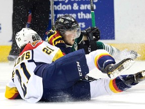 Erie Otters? Patrick Fellows and London Knights? Owen MacDonald hit the ice hard during the first period of Game 3 of their OHL Western Conference semifinal at Budweiser Gardens on Sunday night. (DEREK RUTTAN, The London Free Press)