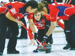 Scotland’s Eve Muirhead takes a shot during her match against Anna Sidorova’s rink on Sunday. (DAVE THOMAS/Toronto Sun)