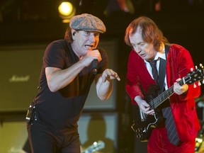Brian Johnson (L) and Angus Young of the Australian band AC/DC play at the Coachella Valley Music and Arts Festival in Indio, California April 10, 2015. REUTERS/Lucy Nicholson