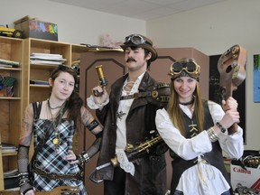 Michelle Dressler, Andrew Greve and Jessica Hiebert dressed up as pirates.