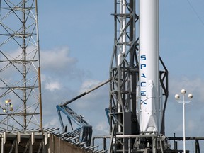 The unmanned SpaceX Falcon 9 rocket with the Dragon capsule waits for its launch to the International Space Station, on Launch Complex 40 at the Cape Canaveral Air Force Station in Cape Canaveral, Florida April 13, 2015. The unmanned SpaceX rocket was poised for launch from Florida on Monday to send a cargo ship to the ISS, then turn around and attempt to land on a platform in the ocean, company officials said. REUTERS/Scott Audette