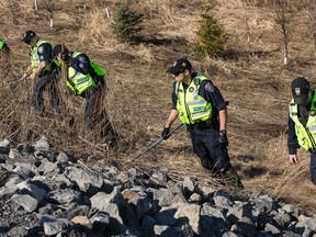 The Ottawa Police Service E.S.U. (Emergency Services Unit) in conjunction with the Major Crime Unit are conducting a search for evidence in the area of Hunt Club Road near Highway 417. The search is in relation to the February 6, 2015 murder of Yusuf Ibrahim. April 13, 2015. 
Errol McGihon/Postmedia Network