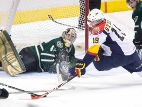 Erie Otter  Dylan Strome does the splits but still manages to get a shot on London Knights goalie Michael Giugovaz during the third period of their OHL playoff hockey game at Budweiser Gardens in London, Ontario on Sunday, April 12, 2015. DEREK RUTTAN/ The London Free Press /QMI AGENCY