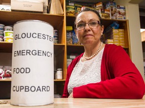(April 10, 2015) Gwen Bouchard, the co-ordinator of the Gloucester Food Cupboard, shows the emgerancy funds that were used so people could take the bus. Glouscester’s had hundreds of dollars worth of bus tickets stolen from them last week. Joel Watson/Ottawa Sun/Postmedia Network