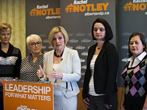 Alberta NDP Leader Rachel Notley, centre, speaks about her party's plan for health care while flanked by (from left) Trudy Thomson, a lab tech, Marg Hayne, a retired registered nurse, Danielle Larivee, candidate for Lesser Slave Lake and Karen Kuprys, a registered nurse, at the Chateau Lacombe in Edmonton, Alta., on Monday, April 13, 2015. Codie McLachlan/Edmonton Sun