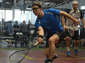 Local national squash team member Mike McCue stretches for shot in this photo.