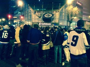 About 600 Winnipeg Jets fans celebrated the team making the playoffs at the city's most famous intersection, Portage Avenue and Main Street, last Thursday. Subsequent wins in the playoffs will probably be celebrated there, too. (KEVIN ENGSTROM/WINNIPEG SUN FILE PHOTO)