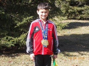 Xavier Olasz of the Loyalist Gymnastics Club finished first all-around in the boys Level 2, ages 8 and 9 category at the Ontario championships in Windsor on the weekend. (Supplied photo)