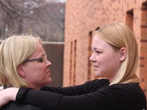 Gail Brown, left, is comforted by daughter Kayla Brown after testifying in Barrie court Monday, April 13, 2015 about her near-fatal beating. (Tracy McLaughlin/Toronto Sun)