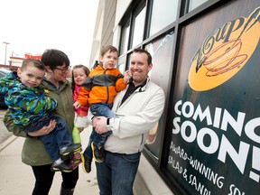 Deb and Daryl Hunter are joined by their triplets Noah, Hannah and Gabe, outside their soon-to-be-open soup restaurant, Zoup! (CRAIG GLOVER, The London Free Press)
