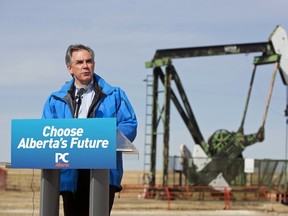 Alberta Premier Jim Prentice addresses ranchers and farmers at an oil well site near Three Hills. Monday. (TODD KOROL/Reuters)