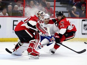 Ottawa Senators goaltender Andrew Hammond stops a shot by Montreal Canadiens Max Pacioretty as Sens Erik Karlsson defends during NHL hockey action at the Canadian Tire Centre on Wednesday February 18, 2015. 
Errol McGihon/Ottawa Sun