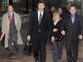 Blackwater Worldwide security guards Evan Liberty (L) and Dustin Heard (R) leave the federal courthouse with their legal team and supporters in Washington, after being arraigned on manslaughter charges in the killing of 14 unarmed civilians and wounding of 20 others in a 2007 shooting in Baghdad, in this January 6, 2009 file photo.  REUTERS/Jonathan Ernst/Files REUTERS/Jonathan Ernst/Files