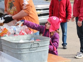 Volunteers young and old gathered at the Melfort Church of Latter Day Saints for a food and bottle drive on Saturday, April 11. the event collected food for the Melfort Food bank and bottles which were cashed in and the money donated to the Melfort Food Bank.