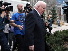 Senator Mike Duffy leaves the Ottawa Courthouse on the Apr. 13, 2015 after day five of testimony in the trial relating to his Senate expense claims. Andrew Meade/ Ottawa Sun/ QMI Agency