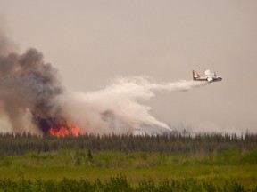 An Alberta ERSD airtanker performs a drop over a wildfire in Alberta. The MD of Pincher Creek recently signed a new 10-year lease with the ERSD to use the Pincher Creek airport as a base in their fight against wildfires. File Photo.
