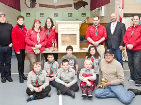 Mayor Peter Politis, CGV Builders’ manager David Butler and supervisor Ron Robichaud, together with Library CEO Christina Blazecka, the1st Cochrane Ontario Scouts group and their leaders at Scout Hall pose with a book box on Saturday Mar. 28th. The group was at Scout Hall to build book boxes for the launch of Cochrane's new Book Share program.