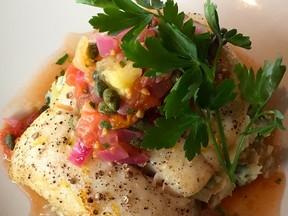 Coriander crusted halibut with tomato caper relish. (Supplied)