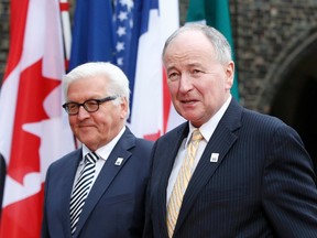 German Foreign Minister Frank-Walter Steinmeier greets his Canadian counterpart Rob Nicholson (R) at Luebeck City Hall, April 14, 2015. G7 foreign ministers will hold a two-day meeting in Luebeck to discuss issues such as Ukraine, the Middle East and Ebola. (REUTERS/Fabrizio Bensch)