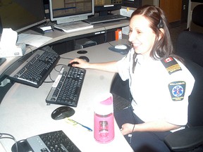 Dawn Lucier takes a call at the Wallaceburg Central Ambulance Communication Centre on April 14. The facility hosted an open house to mark National Telecommunicators Week.