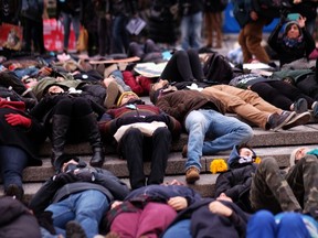 Protesters stage a "die-in" demonstration before they start a march against racism in New York on January 19, 2015. Critics of police treatment of minority residents in the US took part in various demonstration across the country coinciding with the observance of Martin Luther King Jr. Day, an American federal holiday marking the influential American civil rights leader's birthday. AFP PHOTO/JEWEL SAMAD