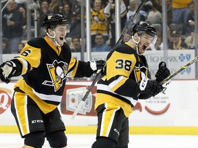 Penguins defenceman Scott Harrington, left, celebrates with forward Zach Sill after Sill scored his first NHL goal against the Chicago Blackhawks in Pittsburgh on Jan. 21. (Charles LeClaire/USA TODAY Sports)
