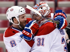 Montreal Canadiens goalie Carey Price (right) receives congratulations from teammate Brandon Prust after a win over the Detroit Red Wings at Joe Louis Arena. (Rick Osentoski/USA TODAY Sports)