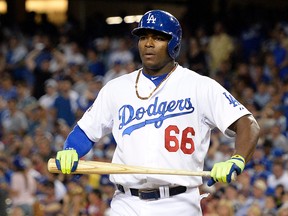 Los Angeles Dodgers right fielder Yasiel Puig reacts after striking out against the St. Louis Cardinals in Game 2 of the 2014 NLDS at Dodger Stadium. (Richard Mackson/USA TODAY Sports)
