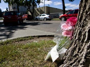 A bouquet of flowers, as seen on on Aug. 15, 2012, marked the spot where Dale Maloney was fatally shot on Aug. 13 during a dispute in a parking lot behind Joey Jasper restaurant at 113 Street and Jasper Avenue in Edmonton, Alberta. The family has asked for privacy to mourn Maloney. IAN KUCERAK/EDMONTON SUN