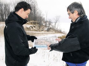 Peter Dutchak, left, deputy director of engineering services for Elgin county, and Clayton Watters, director, point out on a topographical map a severe section of erosion bordering Elgin County Road 24 (Dexter Line), two km west of Port Bruce in this 2011 picture.