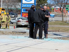 A vehicle drove through a bus shelter at Sutherland Drive and Montreal Street Wednesday morning. (Steph Crosier, The Whig-Standard, Postmedia Network)