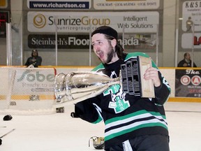 Zack Waldvogel lifts the Turnbull Trophy after the Portage Terriers won the 2014-15 MJHL Championship, beating Steinbach 4-3 on April 14 in Steinbach to complete a series sweep. Portage went a perfect 12-0 through the MJHL playoffs. (Matt Hermiz/TheGraphic/Postmedia Network)