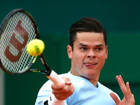 Milos Raonic of Canada returns the ball to Joao Sousa of Portugal during their match at the Monte Carlo Masters in Monaco April 15, 2015. (REUTERS/Eric Gaillard)