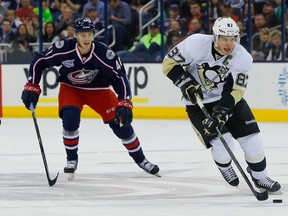 Pittsburgh Penguins centre Sidney Crosby talks with linesman Don Henderson during a time-out against the St. Louis Blues during the second period at the CONSOL Energy Center on March 24, 2015. (Charles LeClaire/USA TODAY Sports)