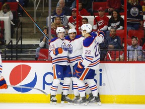Nail Yakupov, centre, and Ryan Nugent-Hopkins, shown here celebrating a goal with Oilers defenceman Keith Aulie, have both been determined by the team to be unable to play at the world championship due to inury. (USA TODAY SPORTS)