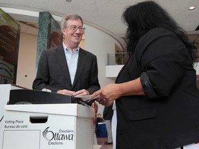 Ottawa mayor Jim Watson got a chance to vote at a special advance poll at Ottawa City Hall in Ottawa Wednesday Oct 1,  2014. (Tony Caldwell/Ottawa Sun)