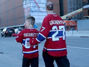 Montreal Canadiens fans walk to the Bell Centre in Montreal Wednesday April 15,  2015. The Ottawa Senators took on the Montreal Canadiens during game one of the Stanley Cup Playoffs Wednesday in Montreal.  Tony Caldwell/Postmedia Network