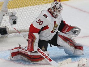 Ottawa Senators Andrew Hammond mades a save against the Montreal Canadians during first period action at the Bell Centre in Montreal Wednesday April 15,  2015. The Senators and Canadians were playing game one of the Stanley Cup Playoffs.  Tony Caldwell/Postmedia Network