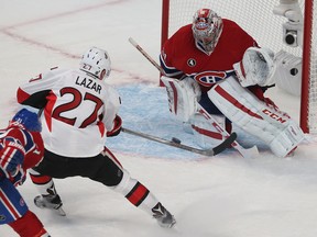 Ottawa Senators Curtis Lazar tries to score on Montreal Canadiens Carey Price during first period action at the Bell Centre in Montreal Wednesday April 15,  2015. The Senators and Canadiens were playing game one of the Stanley Cup Playoffs.  Tony Caldwell/Postmedia Network